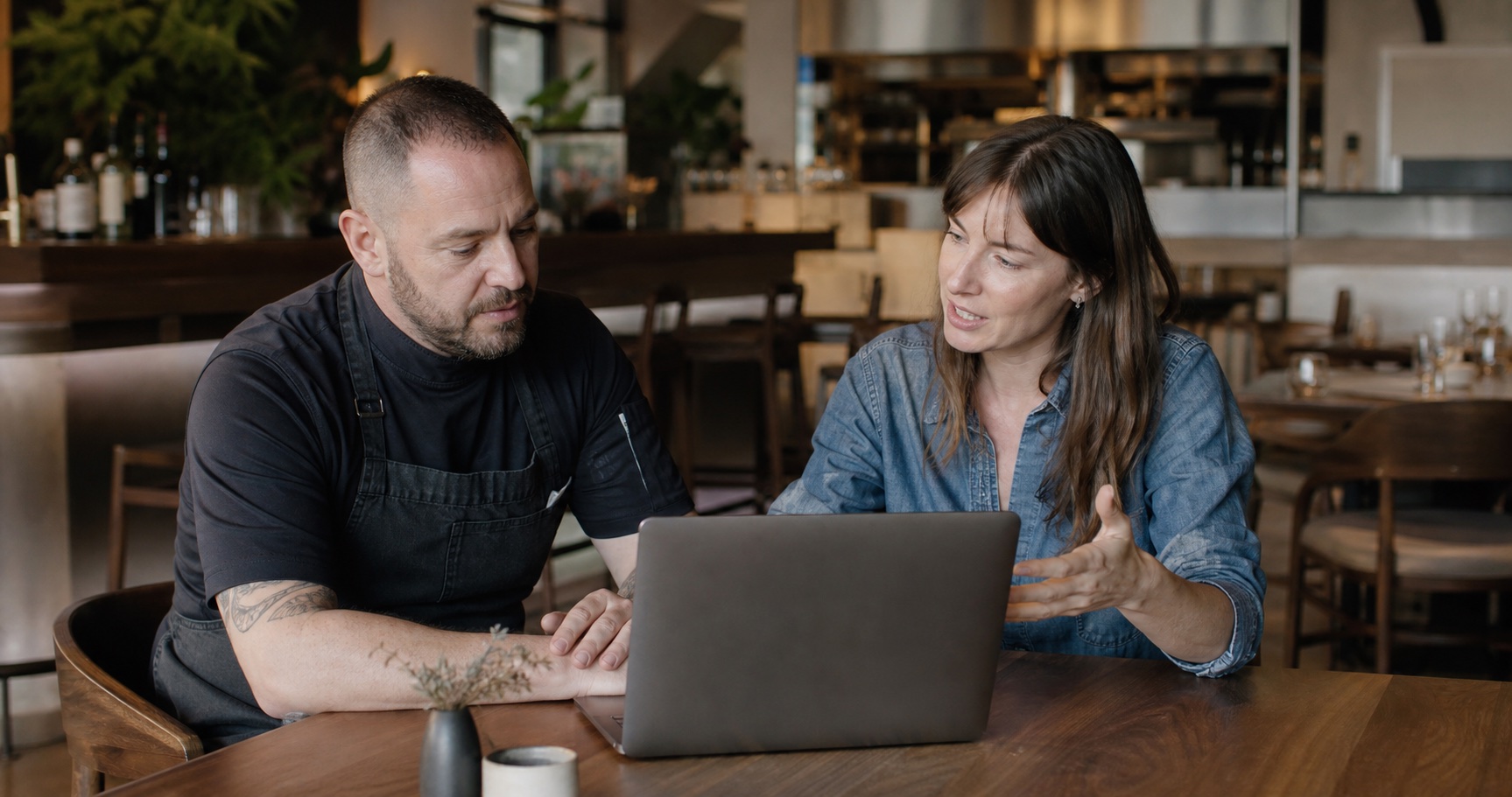 A restaurant operator and product specialist talking through opsi together
